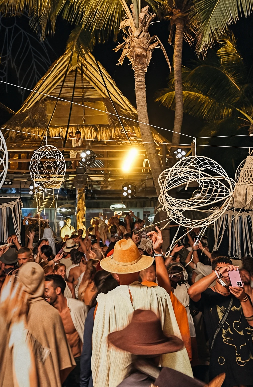 Guests beneath illuminated sculptures in the Soulful Experience portfolio chapter